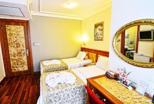 Postel nebo postele na pokoji v ubytování Santa Ottoman Hotel