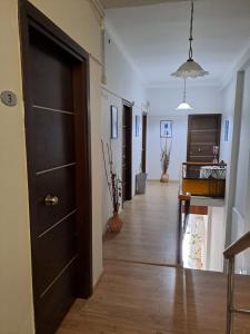 a hallway of a house with a door and a hallwayngth at Parthenon Hotel in Souda