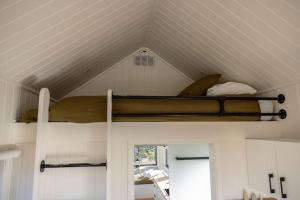 a bunk bed in a room with a ceiling at Tiny Charlie in Haden