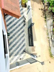 an overhead view of a building with a black gate at Matheera holiday home in Jaffna