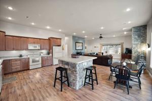 a large kitchen with a table and chairs in it at Fawn Run on Lake Cumberland in Nancy