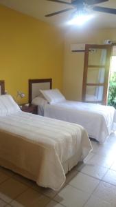 Cama ou camas em um quarto em La Casona del Lago