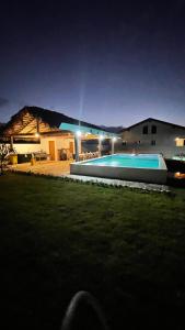 a house with a swimming pool at night at Villa luxury puerto plata RD in San Felipe de Puerto Plata