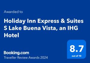 een blauw bord met de tekst Holiday Inn Express en suites Lake buena vista bij Holiday Inn Express & Suites S Lake Buena Vista, an IHG Hotel in Kissimmee