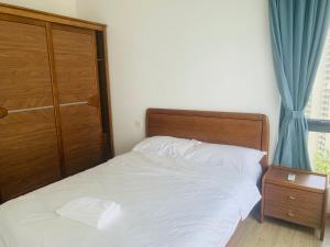 Postel nebo postele na pokoji v ubytování 高性价比三房民宿