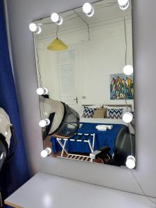 a mirror in a room with a dressing room at Via Zara in Palermo