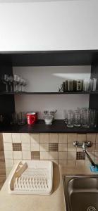 a kitchen with a sink and a cutting board on a counter at U Jędrusia in Zubrzyca Górna