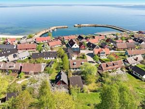an aerial view of a small village by the water at 4 person holiday home in KIVIK in Kivik