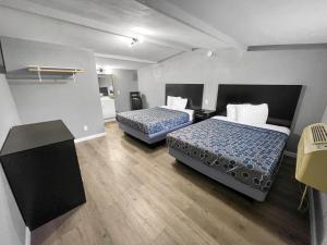Postel nebo postele na pokoji v ubytování Sands Inn