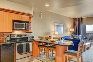 a kitchen with a table and chairs in a room at Diligence at The Platinum - NO Resort Fees and Free Parking in Las Vegas
