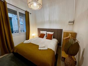 Кровать или кровати в номере LE PETIT PECHEUR DE CASSIS