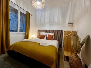 Кровать или кровати в номере LE PETIT PECHEUR DE CASSIS