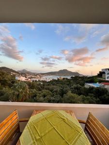 a view of a city from a balcony at Olive Grove in Plakias