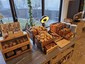 a bunch of boxes filled with different types of bread at Aktiv Hotel Winterberg in Winterberg