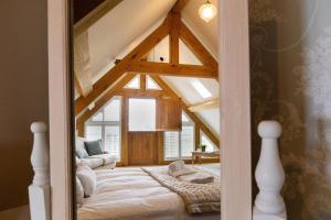 a bedroom with a bed in a room at Plas Robin in Llandyssil