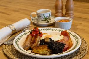 a plate of food on a table with a plate of food at Plas Robin in Montgomery