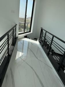 a balcony with a glass floor in a building at Superior Villa 5 Bedrooms in Mirpur Azad kashmir 