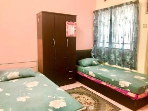Cama o camas de una habitación en Isyfaq Homestay 4 Bedroom & 3 Bathroom