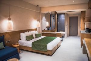 a hotel room with a bed and a kitchen at Panorama Hotel in Falasarna