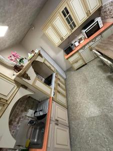 an overhead view of an empty kitchen with a sink at Popock City Center in Yerevan