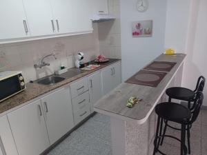 Kjøkken eller kjøkkenkrok på Vivienda Vacacional a 50 Metros de la Playa