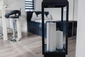 a room with a bed and a mirror with towels at Fewo Jule in Sondershausen
