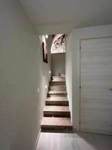 a staircase in a house with a white wall at 5terre for you Manarola in Manarola