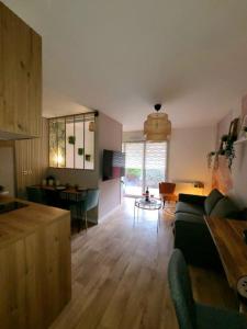 Ruang duduk di Le Parc, logement de charme avec SPA privatif - LE HAVRE