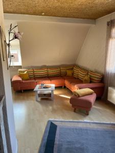 a living room with a couch and a table at Holiday in Wildflecken
