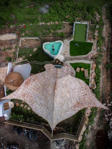 an aerial view of a building with an umbrella at Camanta Penida - Adult Only in Nusa Penida
