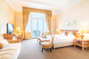 TV a/nebo společenská místnost v ubytování Strandhotel Möwe