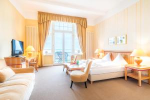 TV a/nebo společenská místnost v ubytování Strandhotel Möwe