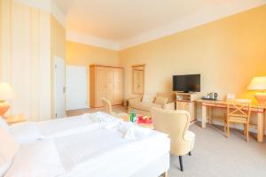 Postel nebo postele na pokoji v ubytování Strandhotel Möwe
