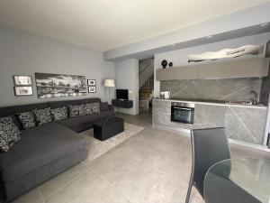 a living room with a couch and a fireplace at Polinesia 5 in Lido delle Nazioni
