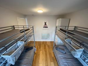 two bunk beds in a room with a hallway at North Wales Lake View 2 Bedroom in Caernarfon