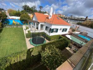 an aerial view of a house with a swimming pool at Belas Rustic Chick in Belas
