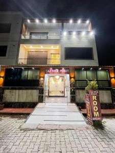 a entrance to a building with a sign in front of it at Taj Nice Point Manage by Taj Sunrise Group in Agra