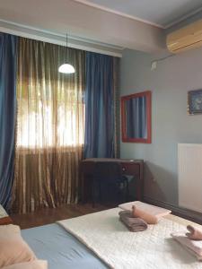 Postel nebo postele na pokoji v ubytování Villa Asteria