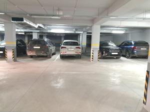 a group of cars parked in a parking garage at AIRPORT/PARKING/VINIETA.MD in Chişinău