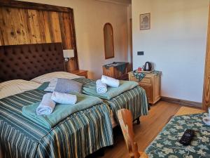 Postel nebo postele na pokoji v ubytování Gasthaus Auwirt