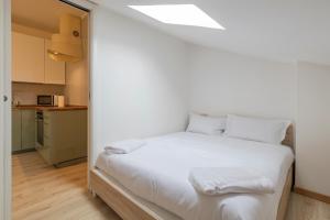 a bedroom with a white bed in a room at [IHost Apartment] - Adige 17 in Milan