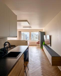 a kitchen with a sink and a counter top at Studio By Aimee - 20m from the beach & in city centre! in Ostend