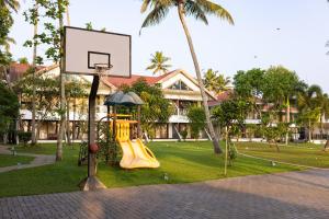 a playground with a basketball hoop in a park at Lake Canopy Alleppey in Mararikulam