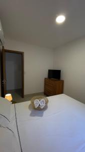 Ein Bett oder Betten in einem Zimmer der Unterkunft Apto JP 301 para 2 pessoas