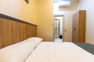 Postel nebo postele na pokoji v ubytování Valens Boutique Hotel