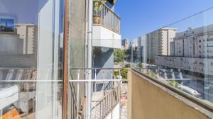 a view of a city from a balcony of a building at Charming Boavista Apartment by Unique Hosts in Porto