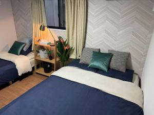Postel nebo postele na pokoji v ubytování Sky Terrace 新築独栋戸建 阳光露台观景天空树