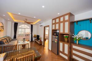 a living room with a couch and a table at AN'S HOUSE- Luxury family 2BR apt view Sea & Cable car in Phu Quoc +34 photos