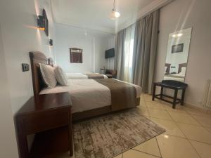 Ένα ή περισσότερα κρεβάτια σε δωμάτιο στο Hôtel Amouday