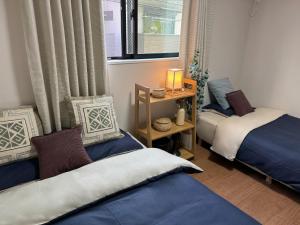 Postel nebo postele na pokoji v ubytování Sky Terrace 新築独栋戸建 阳光露台观景天空树